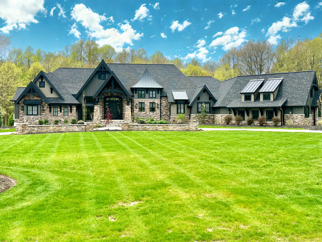 Completed stone estate home and lawn