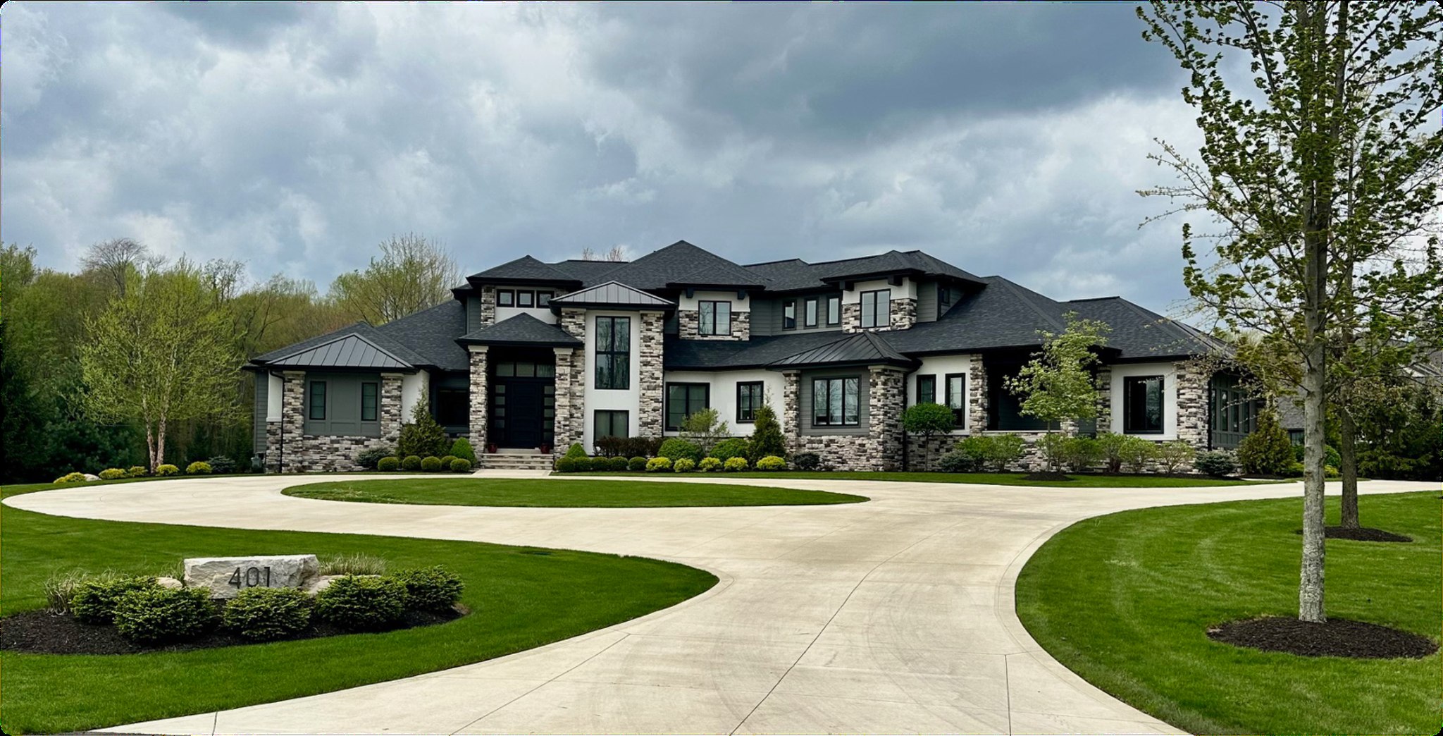 Completed custom home with circular drive