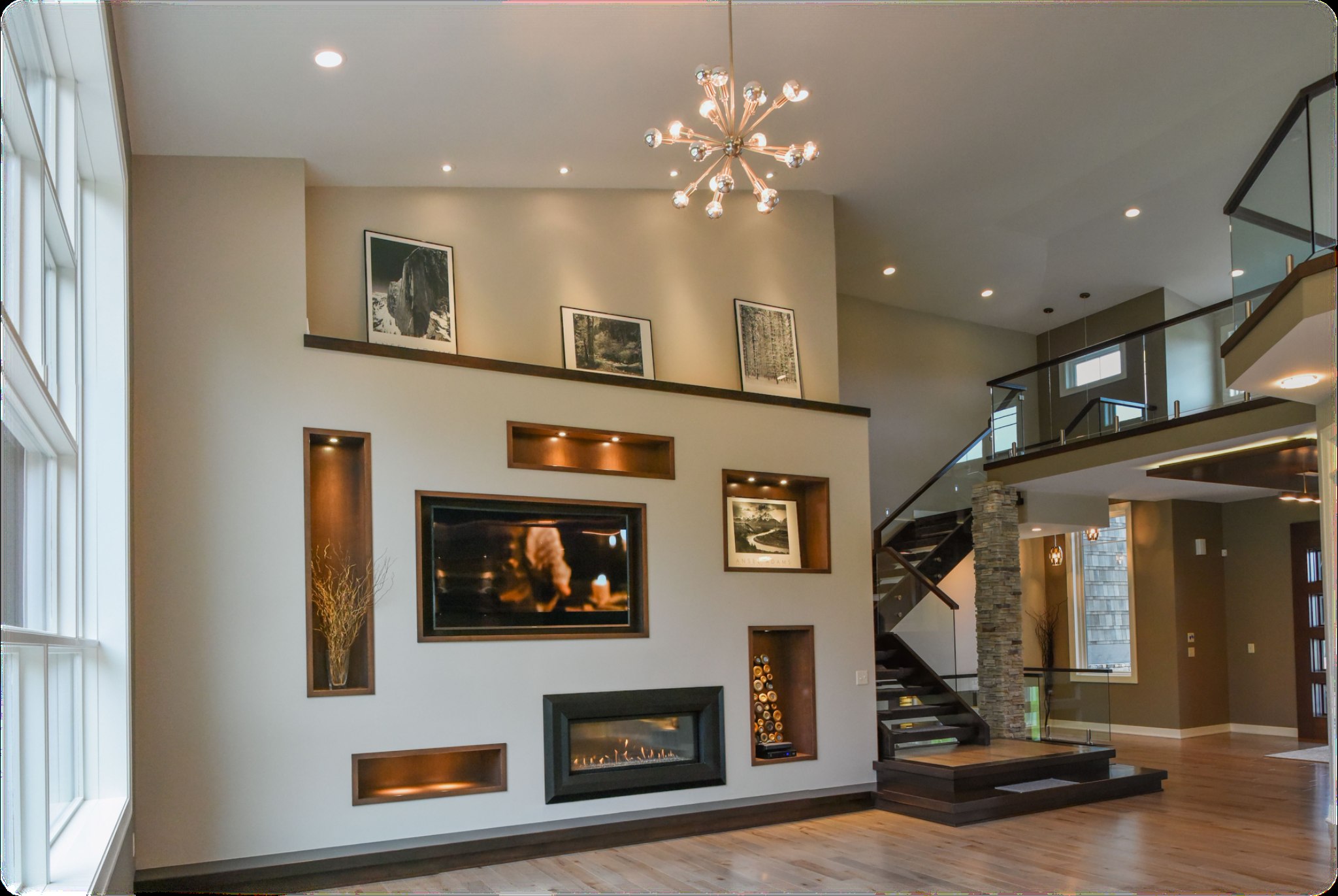 Interior of a completed custom home with soaring ceiling and fireplace
